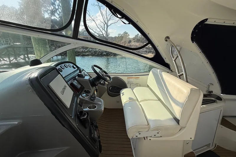 Slide: The Image of 2007 Cruisers Yachts 420 Express docked, featuring sleek windshield design. - 5