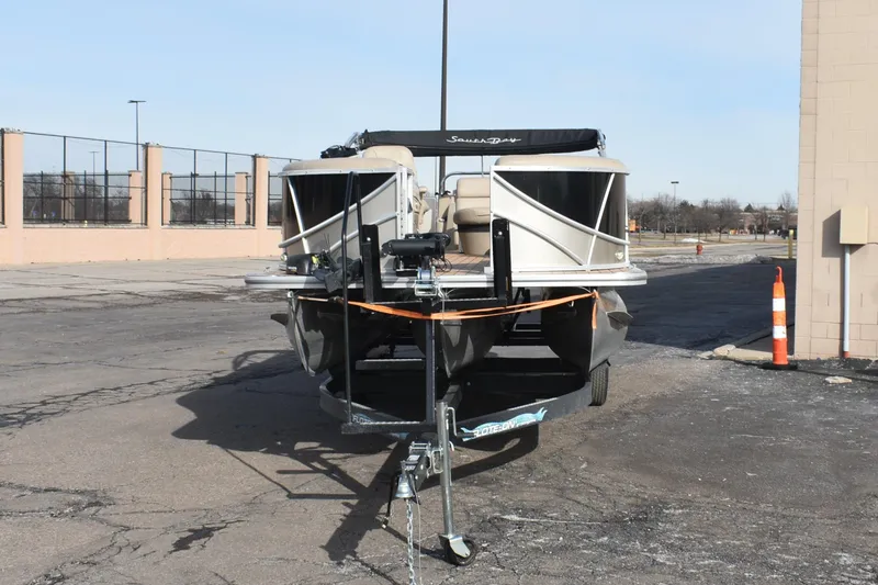 Slide: The Image of 2019 South Bay 523FCR pontoon boat on trailer in parking lot. - 3