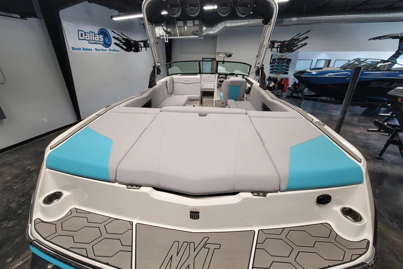 Slide: The Image of 2024 MasterCraft NXT24 boat interior at Dallas Boat House showroom. - 18