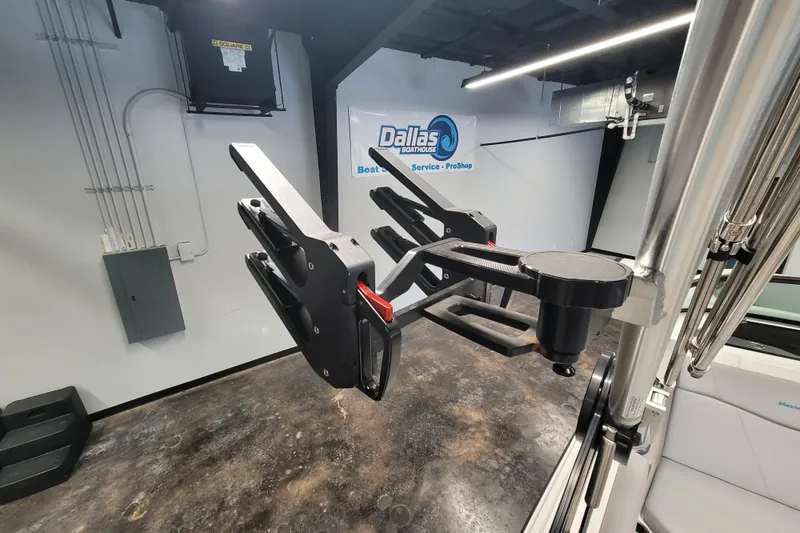 Slide: The Image of 2024 MasterCraft NXT24 boat accessory in showroom, featuring advanced equipment and sleek design. - 19