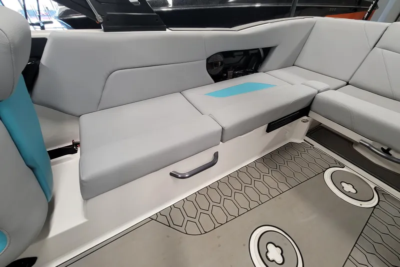 Slide: The Image of 2024 MasterCraft NXT24 boat interior with gray seating and modern design. - 25