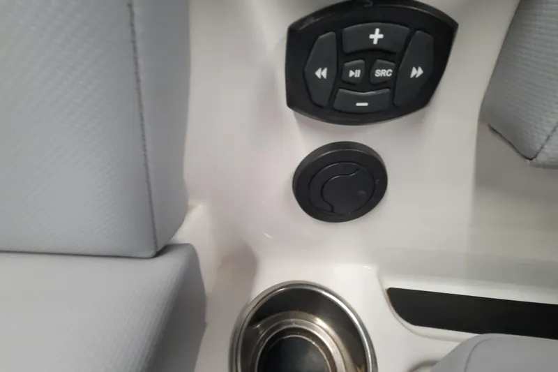 Slide: The Image of 2024 MasterCraft NXT24 boat interior with control panel and cup holder. - 30