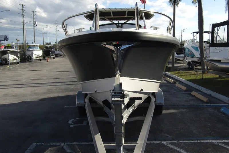 Slide: The Image of 2023 Windy SR28 CC boat on trailer in parking lot, front view. - 4