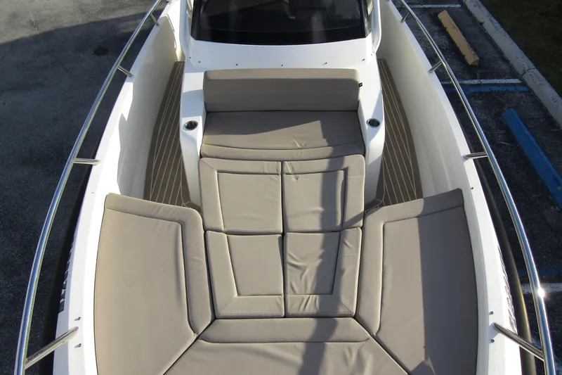 Slide: The Image of 2023 Windy SR28 CC boat with spacious cushioned seating area. - 7