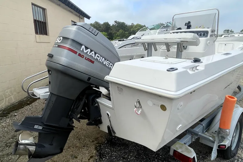 Slide: The Image of 1996 PROLINE 19 boat with Mariner 150 outboard motor on trailer. - 5