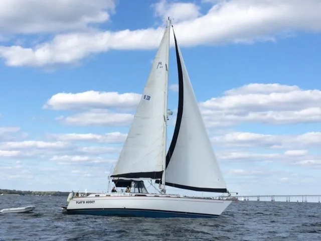 Slide: The Image of 1989 Morgan 44 sailboat on open water. - 44