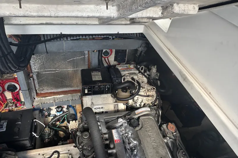 Slide: The Image of Engine compartment of a 2004 Luhrs 32 Open boat, featuring Kohler power systems. - 31