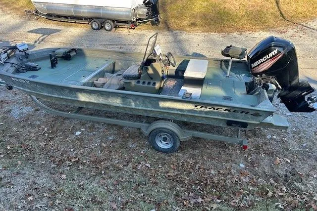 Slide: The Image of 2016 Tracker Grizzly 2072 MVX CC boat with Mercury outboard motor on trailer. - 10
