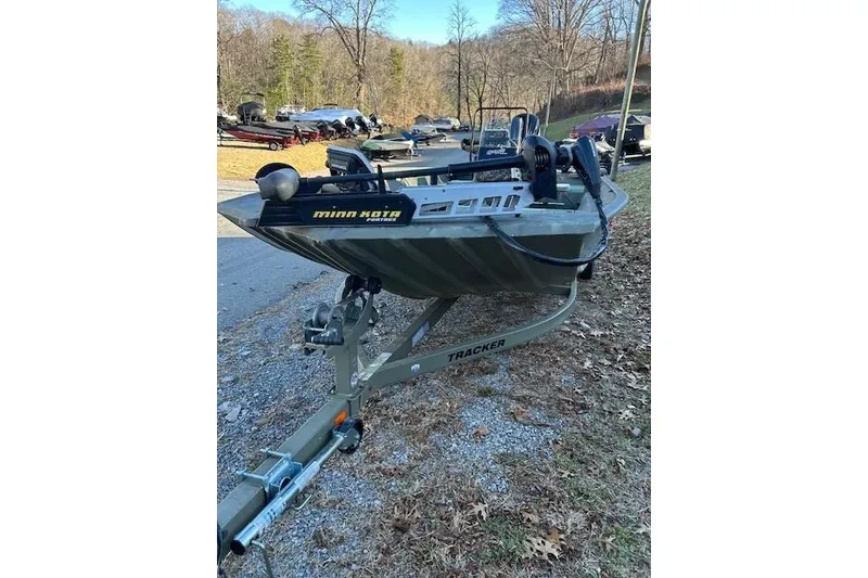 Slide: The Image of 2016 Tracker Grizzly 2072 MVX CC boat on trailer, equipped with Minn Kota motor. - 14