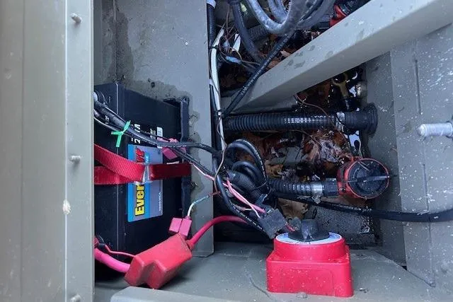 Slide: The Image of Battery compartment of 2016 Tracker Grizzly 2072 MVX CC with wiring and connectors. - 7