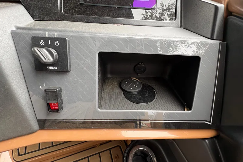 Slide: The Image of Control panel of 2025 Avalon Excalibur LTD Quad Lounge boat with Yamaha ignition. - 10