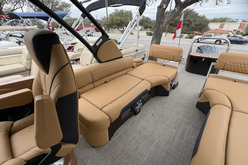 Slide: The Image of 2025 Avalon Excalibur LTD Quad Lounge interior with luxurious tan seating and modern design. - 13