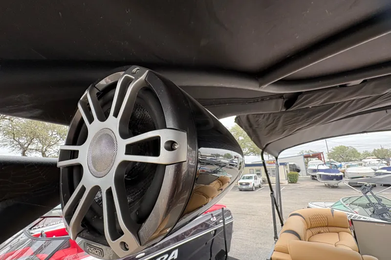 Slide: The Image of 2025 Avalon Excalibur LTD Quad Lounge boat with premium speaker system and luxurious seating. - 15