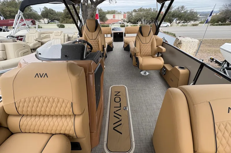 Slide: The Image of Luxurious 2025 Avalon Excalibur LTD Quad Lounge boat interior with tan leather seating. - 5