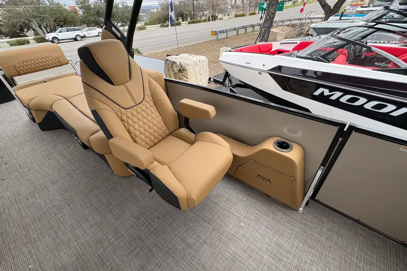 Slide: The Image of Luxurious seating on 2025 Avalon Excalibur LTD Quad Lounge boat, featuring tan upholstery and modern design. - 6