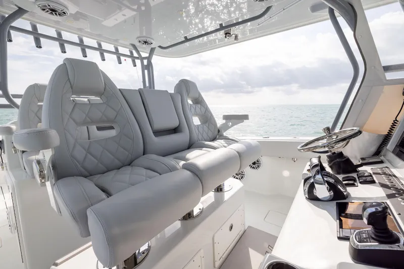 Slide: The Image of Luxurious interior of 2022 Freeman 42LR boat with plush seating and modern controls. - 17