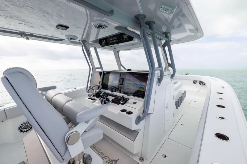 Slide: The Image of 2022 Freeman 42LR boat interior with advanced navigation system and luxurious seating. - 18