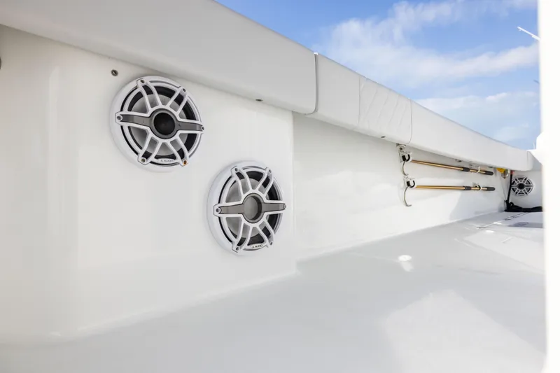 Slide: The Image of 2022 Freeman 42LR boat interior with speakers and rod holders, showcasing sleek design. - 22