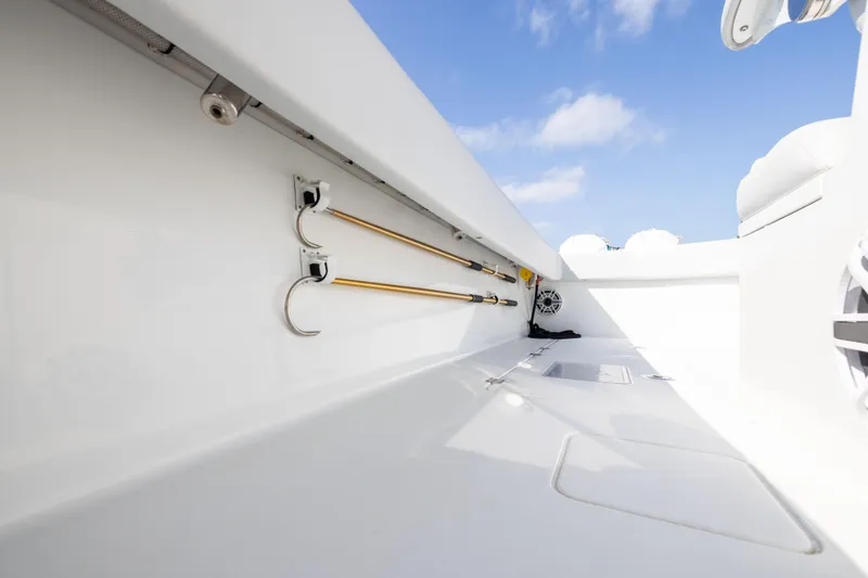 Slide: The Image of Interior view of 2022 Freeman 42LR boat with fishing rod holders and storage. - 23