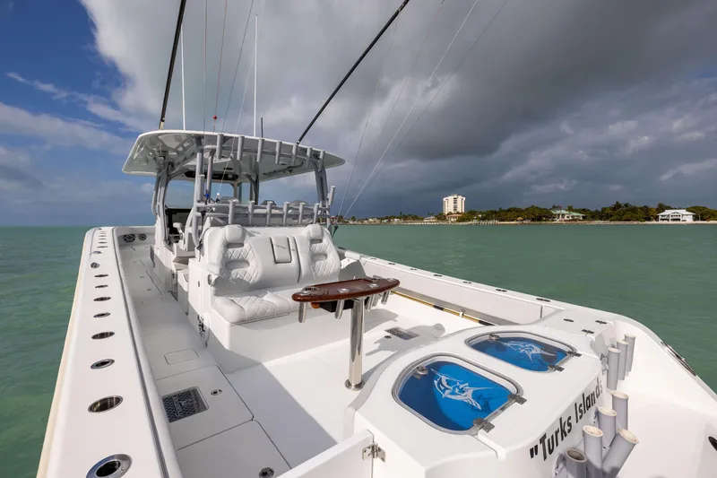 Slide: The Image of 2022 Freeman 42LR boat on turquoise waters near a coastal island. - 25