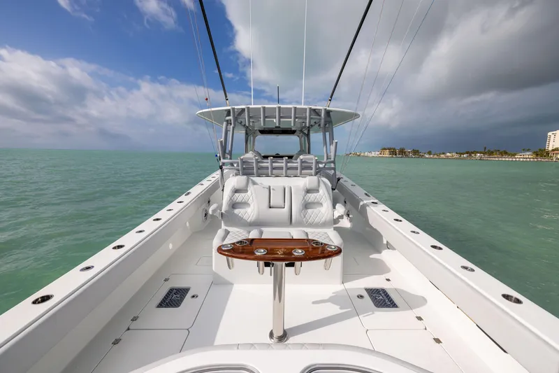 Slide: The Image of Freeman 42LR 2022 boat on calm sea with clear sky and coastal view. - 26