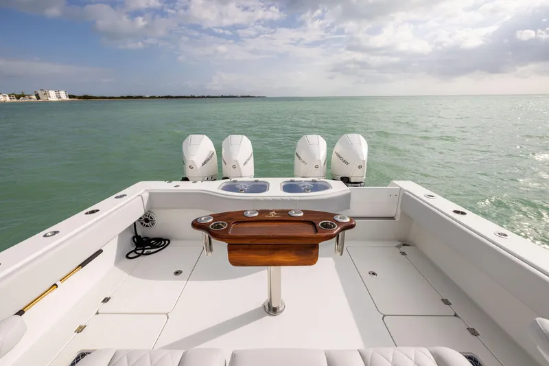 Slide: The Image of Freeman 42LR 2022 boat deck with four engines, ocean view, and fishing station. - 28