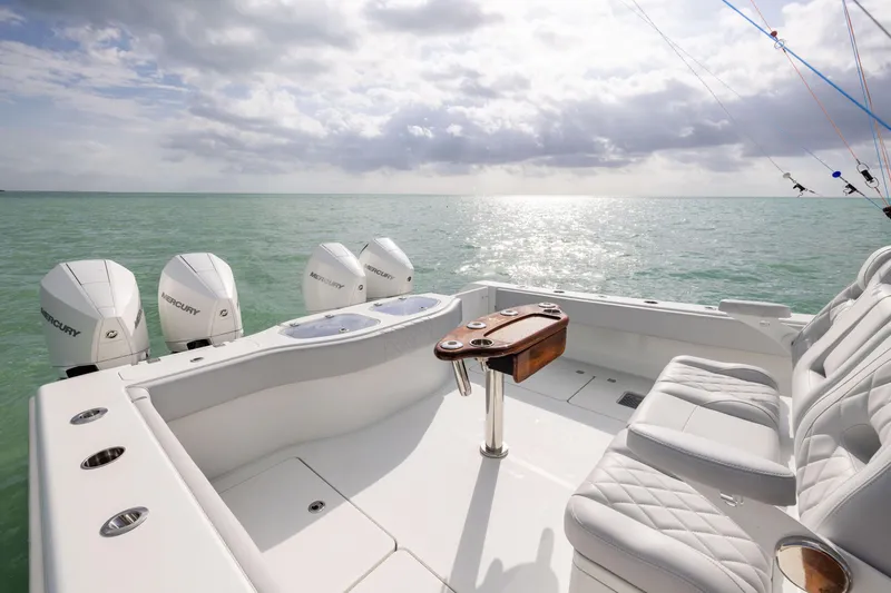 Slide: The Image of Freeman 42LR 2022 boat with Mercury engines on open sea under cloudy sky. - 30