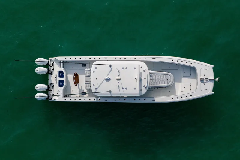 Slide: The Image of Aerial view of 2022 Freeman 42LR boat on turquoise water. - 4