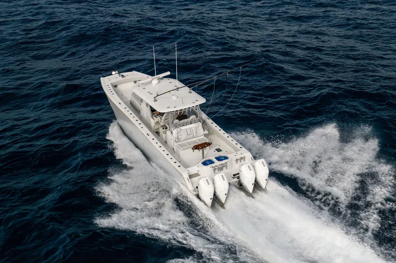 Slide: The Image of 2022 Freeman 42LR boat cruising on open ocean waters. - 5