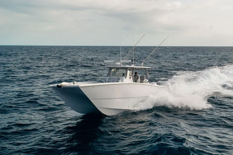 Slide: The Image of 2022 Freeman 42LR boat cruising on open ocean waters. - 6