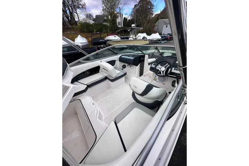 Slide: The Image of 2020 Regal 21 OBX boat interior with modern seating and steering console. - 8