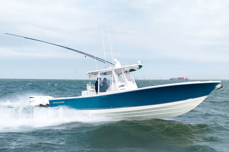Slide: The Image of 2018 Regulator 34SS boat cruising on the ocean. - 1