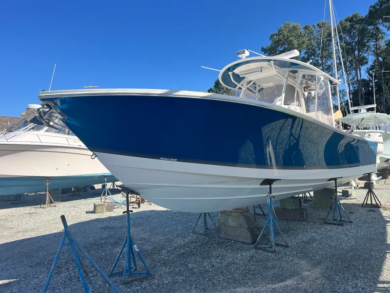 Slide: The Image of 2018 Regulator 34SS boat on stands outdoors. - 2