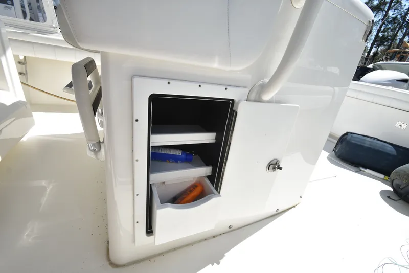 Slide: The Image of Regulator 34SS 2018 boat with open storage compartment. - 21