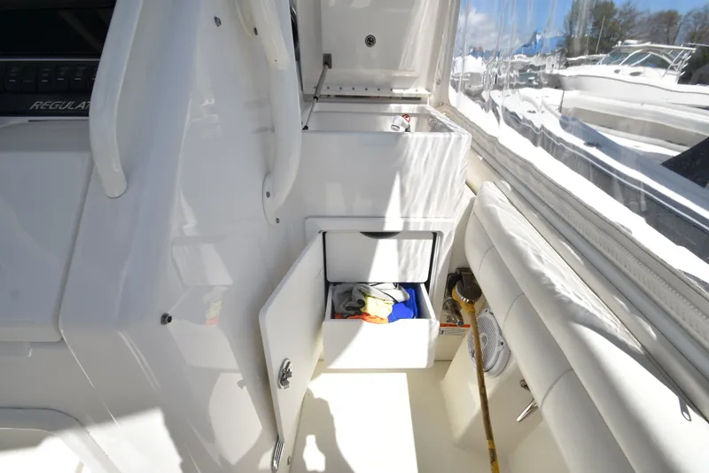 Slide: The Image of Interior of Regulator 34SS boat, showing drawers and storage space. - 22