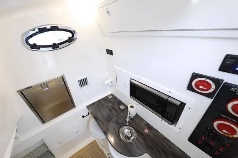 Slide: The Image of Interior of 2018 Regulator 34SS with sink and microwave. - 30