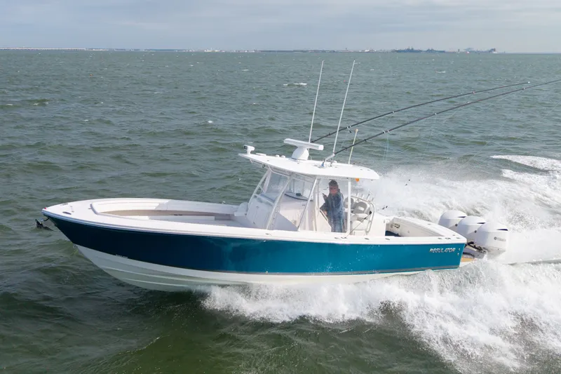 Slide: The Image of 2018 Regulator 34SS boat cruising on the ocean. - 35