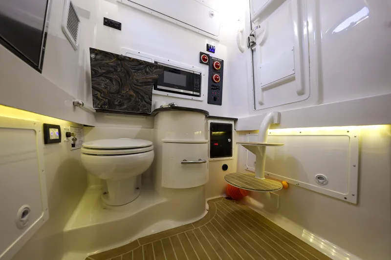 Slide: The Image of Interior of 2018 Regulator 34SS with toilet and microwave. - 36