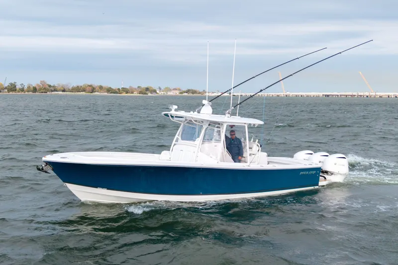 Slide: The Image of 2018 Regulator 34SS boat on water with fishing rods. - 37