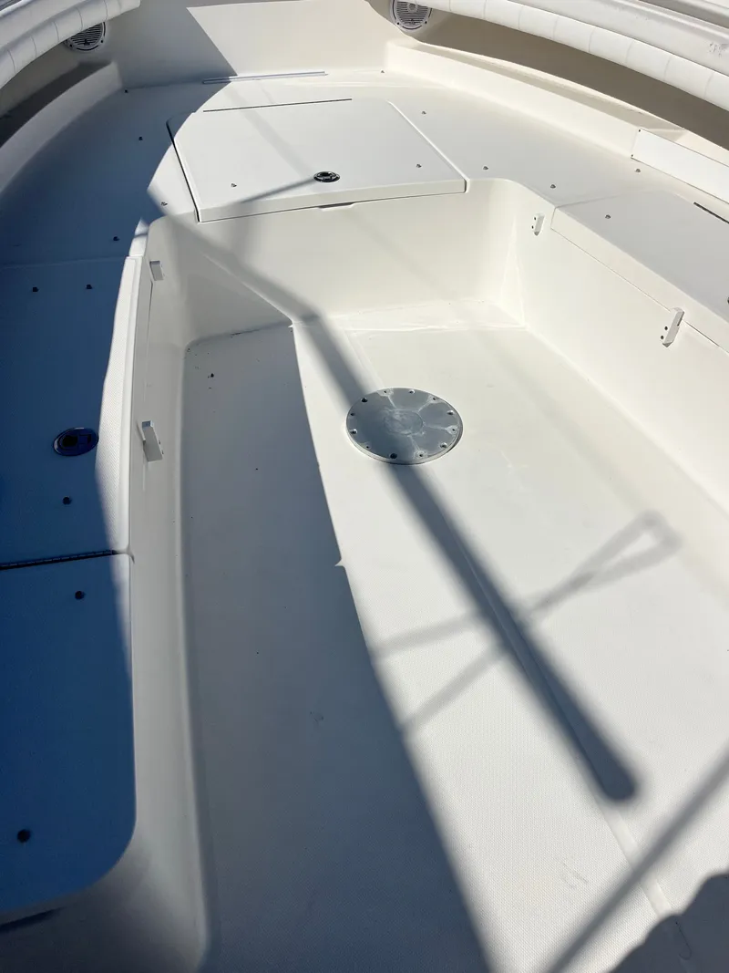 Slide: The Image of Interior of a 2018 Regulator 34SS boat, white deck. - 5