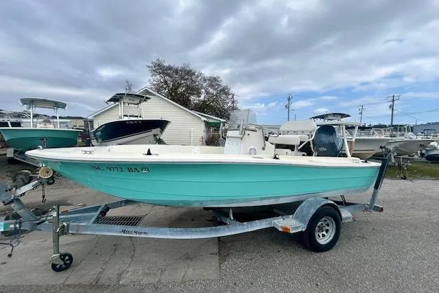Slide: The Image of 1984 Hydra-Sports 1800 CC boat on trailer, parked outdoors under cloudy sky. - 3