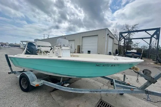 Slide: The Image of 1984 Hydra-Sports 1800 CC boat on trailer, parked outdoors under cloudy sky. - 4