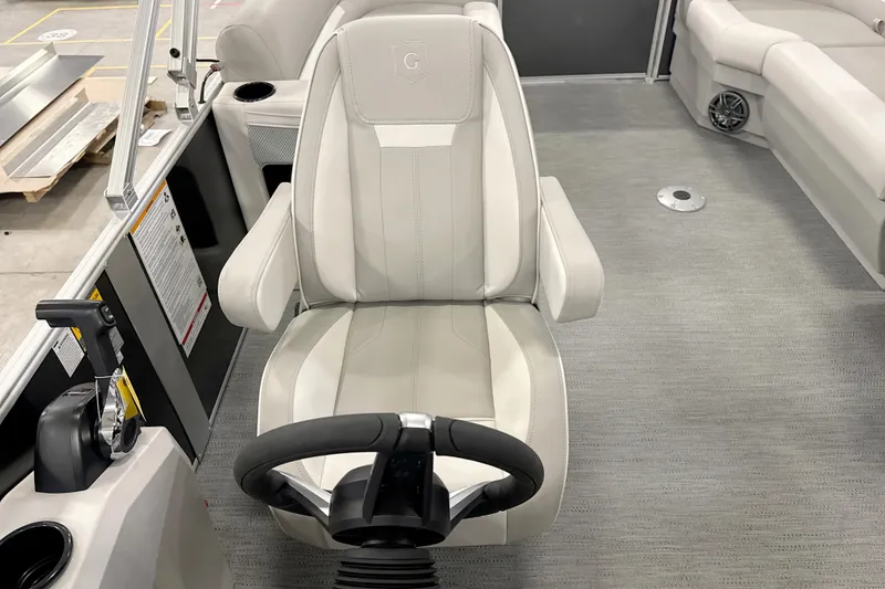 Slide: The Image of Captain's chair and helm of 2026 Godfrey EX 2286 SBX pontoon boat. - 8