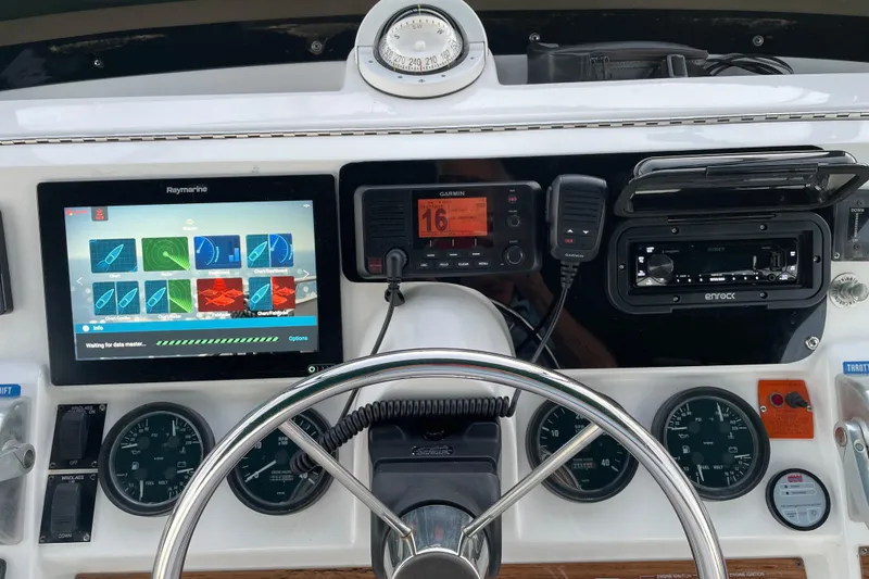 Slide: The Image of Helm of 2003 Mainship 430 Trawler with navigation and communication equipment. - 48