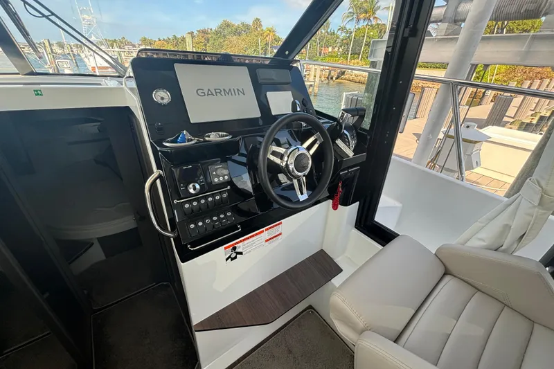 Slide: The Image of 2024 Jeanneau NC Weekender 1095 Fly helm with Garmin navigation system. - 12