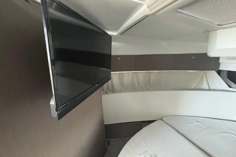 Slide: The Image of 2024 Jeanneau NC Weekender 1095 Fly cabin interior with mounted TV and modern design. - 15