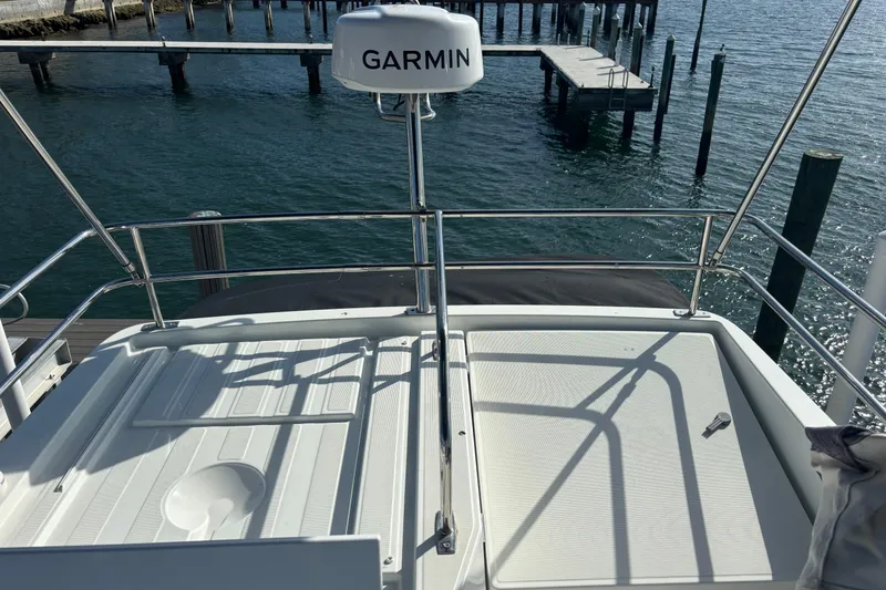 Slide: The Image of 2024 Jeanneau NC Weekender 1095 Fly deck with Garmin radar, dockside view. - 21