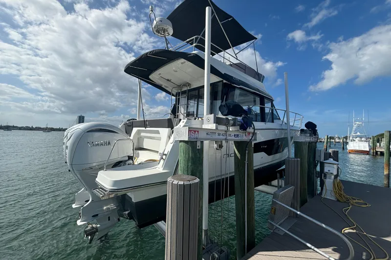 Slide: The Image of 2024 Jeanneau NC Weekender 1095 Fly docked, featuring Yamaha outboard engines. - 26