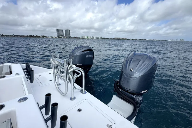 Slide: The Image of 2026 Twin Vee 280 GFX2 CC boat with Yamaha outboard engines on open water. - 10