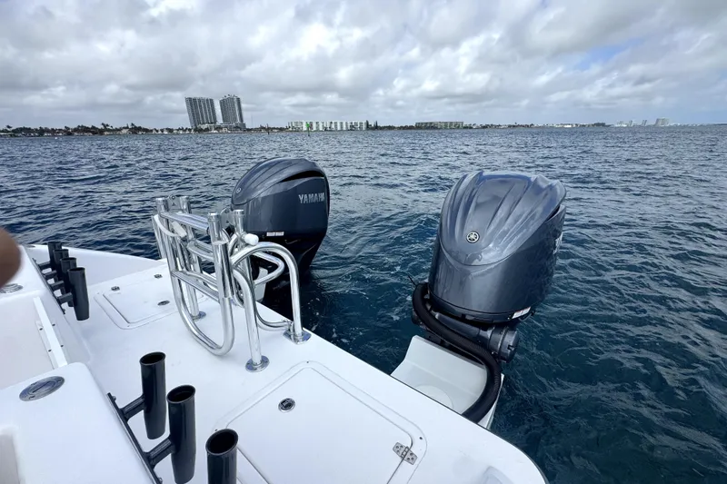 Slide: The Image of 2026 Twin Vee 280 GFX2 CC boat with Yamaha outboard engines on open water. - 11